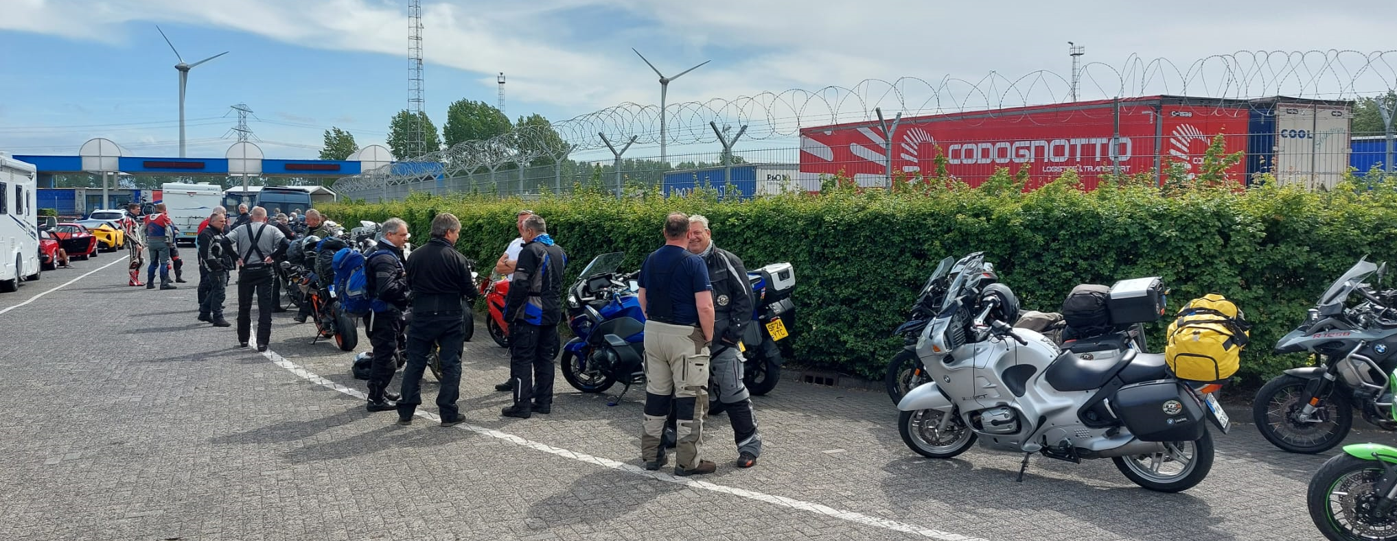 Group of motorcyclists waiting with their bikes at the Rotterdam port for the P&O ferry to Hull, marking the end of a long touring journey