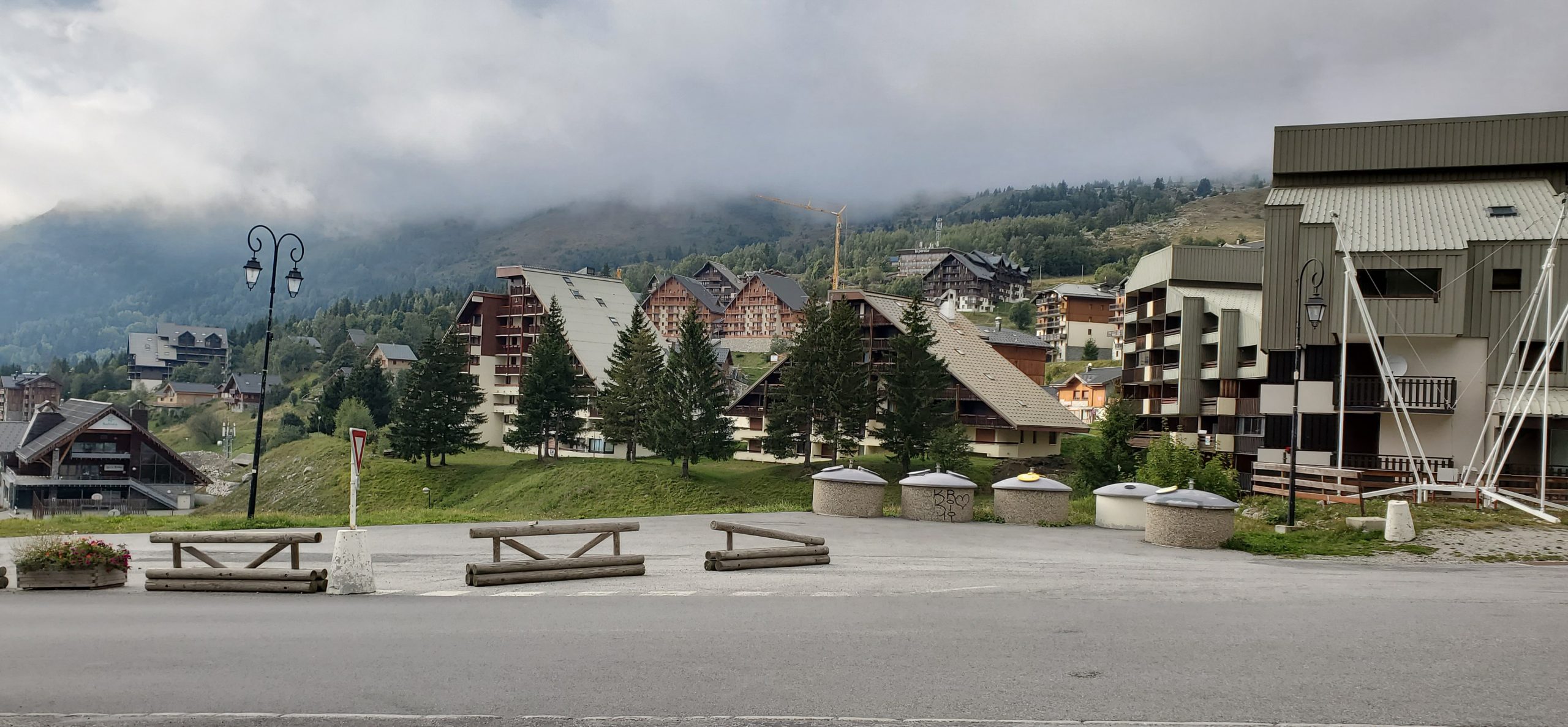 Charming mountain village in Germany’s Black Forest, with alpine-style buildings and misty hills—an inviting stop for motorcycle riders