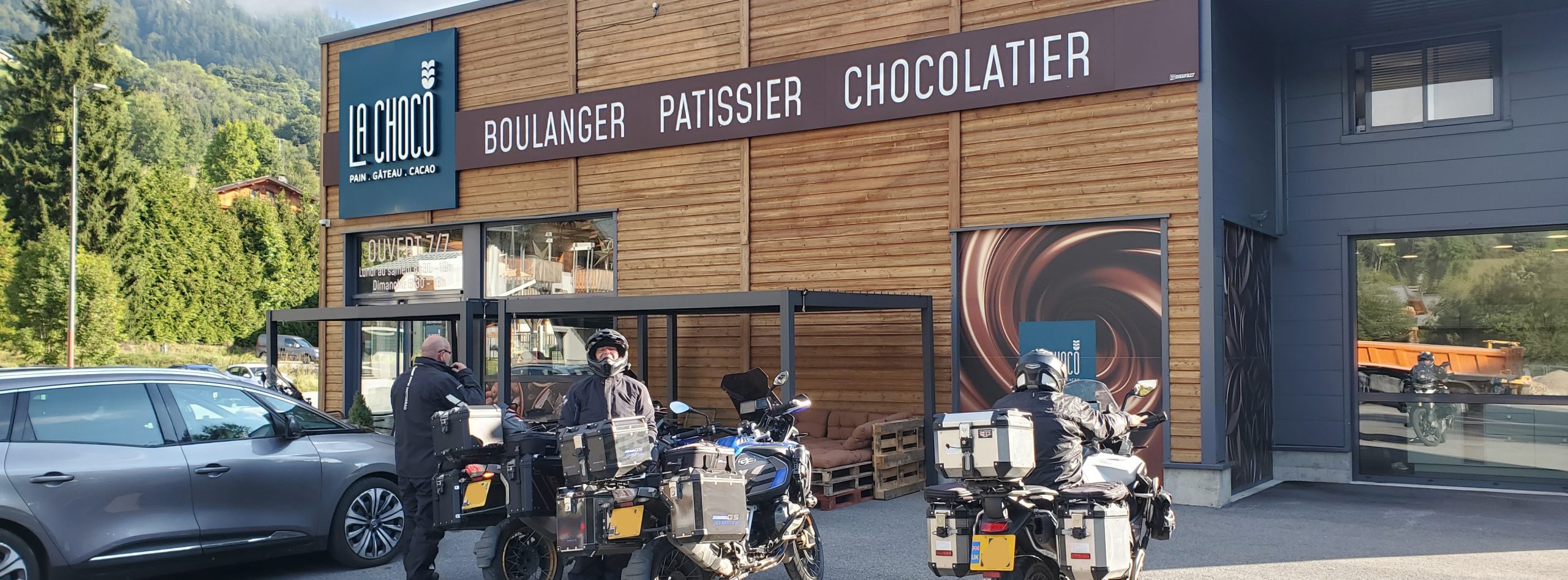 Motorcyclists stop at La Choco boulangerie-pâtisserie in France during a scenic touring ride